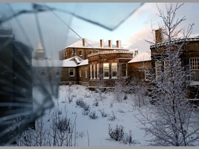 This image consists of a house along with windows. At the top, there is snow on the roof. At the...