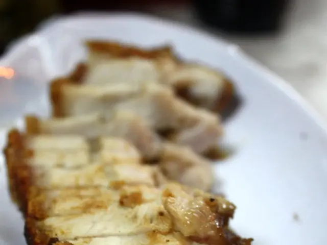 In this image, there is a plate contains some food.