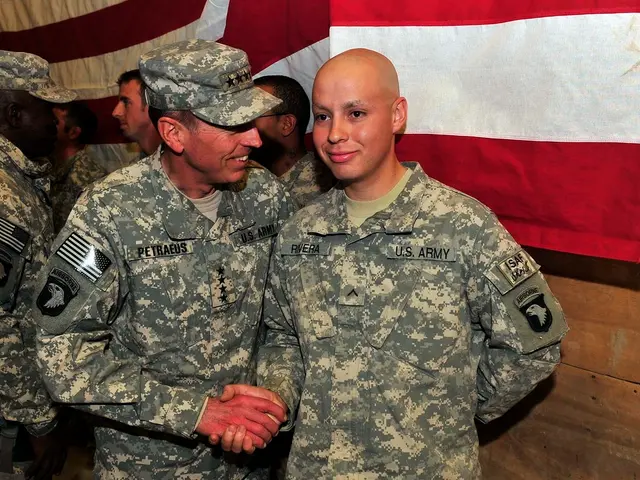 In this picture, we see men in uniform are standing. In front of the picture, two men in uniform...