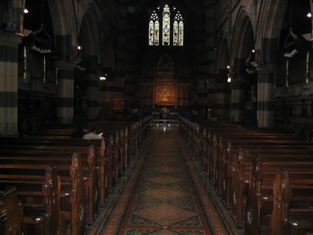 This picture is clicked in the church. There are benches on either side of the picture. On the left...